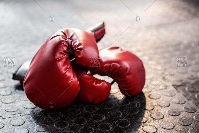 Boxing gloves on the gym floor.